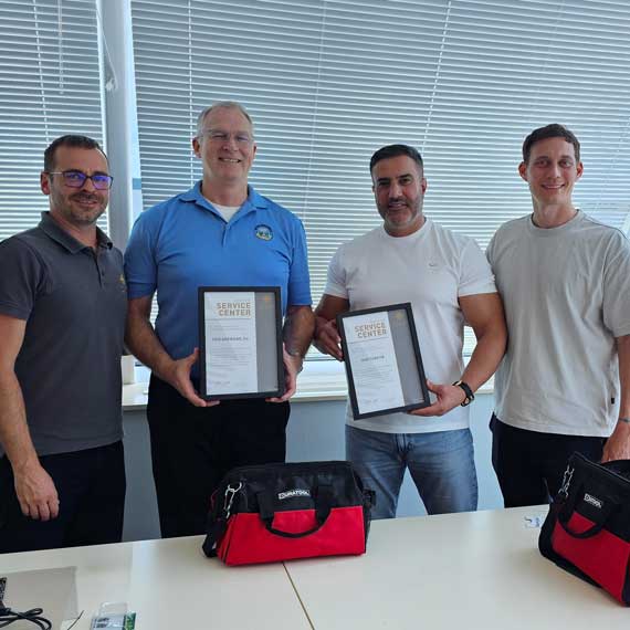 Mark and Kemal receive their certificates after service workshop